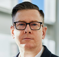 Alexander Hughes, CEO y directivo de una empresa de trading de criptomonedas, en un retrato